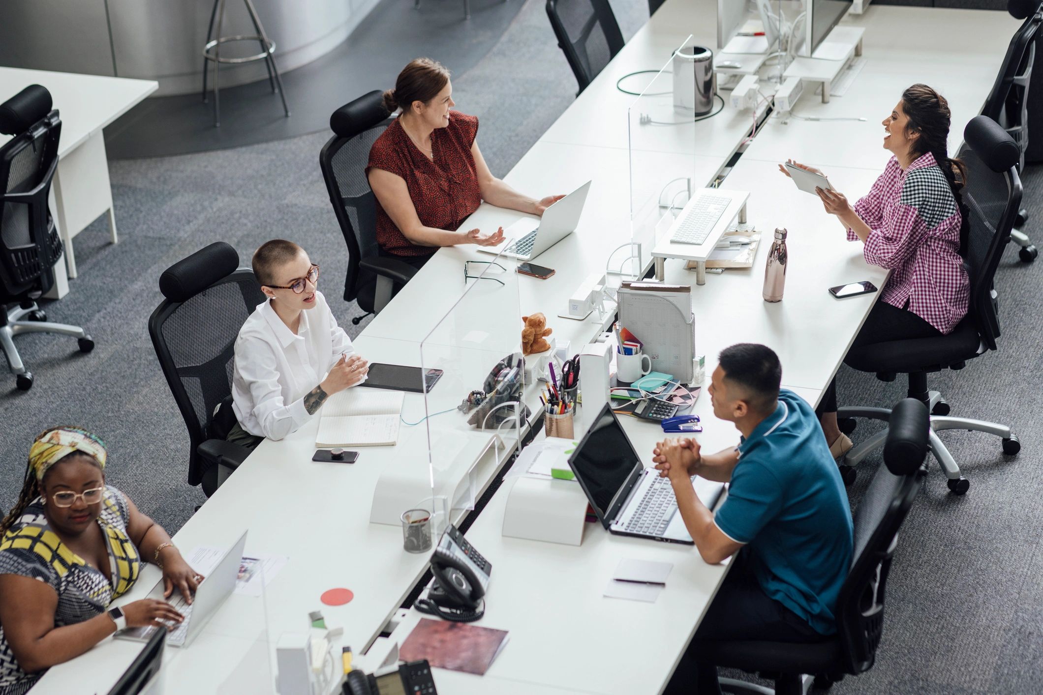 Business team collaborating at desks in a modern office